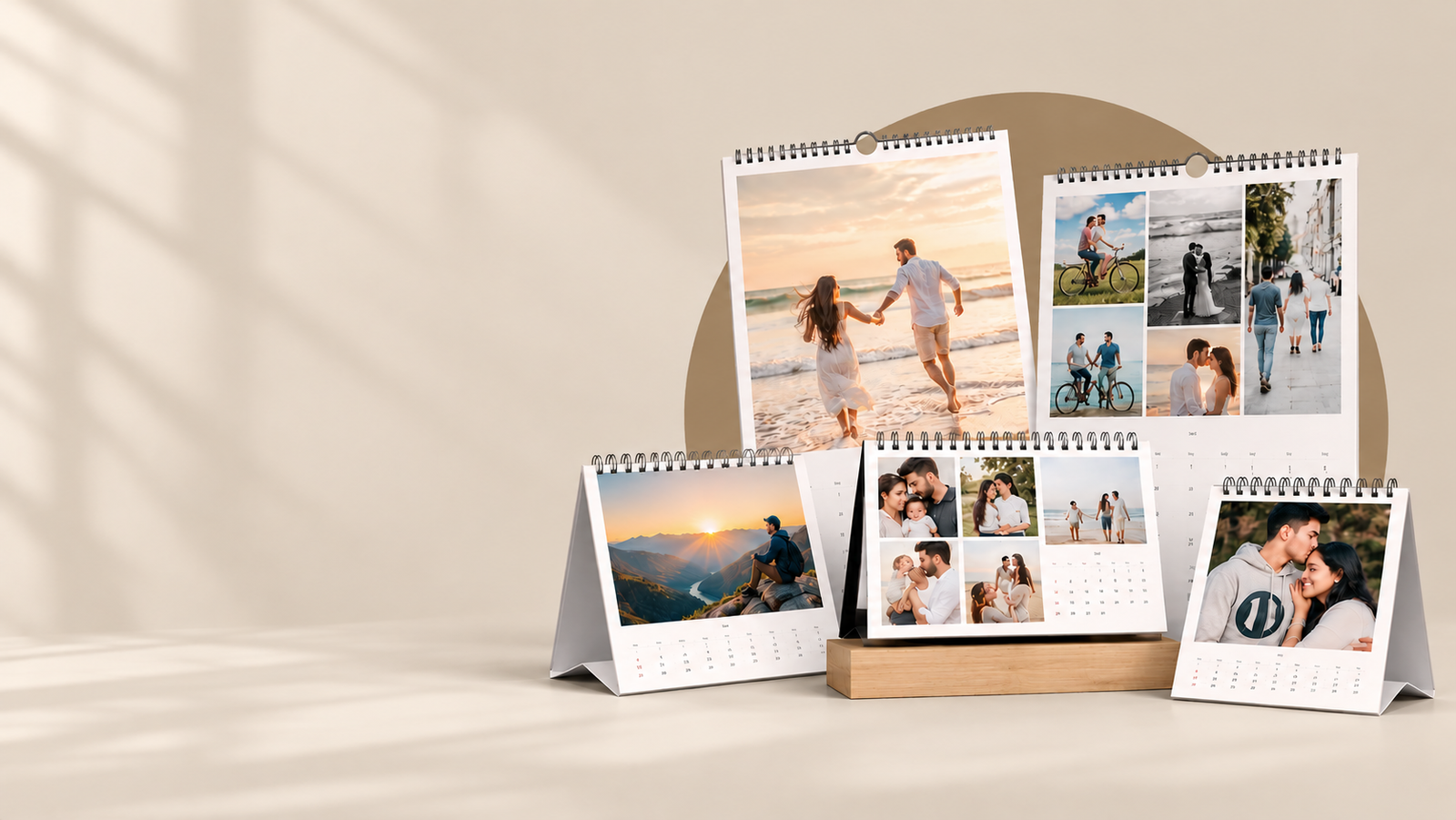 A styled set of personalized 2027 photo calendars with family photos, displayed on a desk and wall